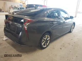 2017 Toyota Prius Two z VIN JTDKARFU7H3041322, wystawiony jako IAAI lot #42358306 z przebiegiem 98 735 mil mil oraz . Historia ofert i sprzedaży dostępna na DreamBid. Obrazek 4.