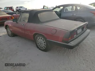 1990 Alfa Romeo Spider z VIN ZARBA12G6L6001683, wystawiony jako Copart lot #75611344 z przebiegiem 59 515 mil mil oraz Szkoda całkowita • Salvage title. Historia ofert i sprzedaży dostępna na DreamBid. Obrazek 2.