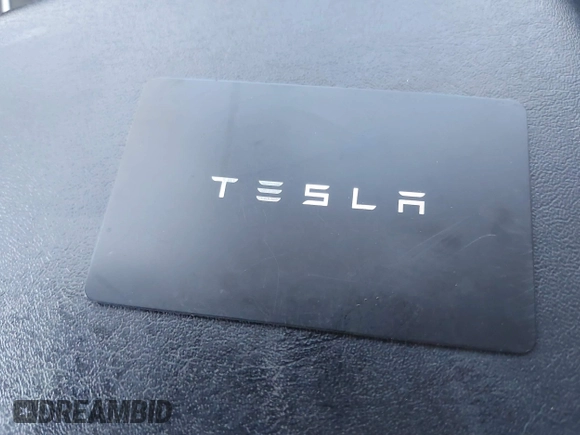 2019 Tesla Model 3 Mid Range with VIN 5YJ3E1EA6KF402308, listed as a IAAI auction lot 40077902 with 89,794 mi miles and . Bid and sale history available at carsss.com. Image 11.
