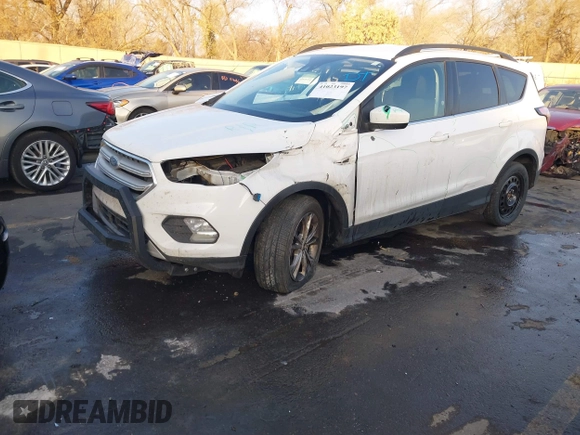 2018 Ford Escape SE z VIN 1FMCU9GD6JUC13023, wystawiony jako IAAI lot #41023197 z przebiegiem 105 489 mil mil oraz . Historia ofert i sprzedaży dostępna na DreamBid. Obrazek 16.