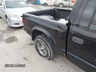 2004 Dodge Dakota Sport with VIN 1D7HL38N24S768283, listed as a IAAI auction lot 41635910 with 328,505 mi miles. Bid and sale history available at carsss.com. Image 12.