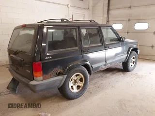 1999 Jeep Cherokee Sport z VIN 1J4FF68S4XL668081, wystawiony jako IAAI lot #42304649 z przebiegiem 194 470 mil mil oraz . Historia ofert i sprzedaży dostępna na DreamBid. Obrazek 4.