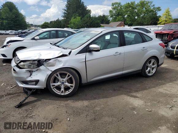 2015 Ford Focus Titanium with VIN 1FADP3J27FL285842, listed as a Copart auction lot 61159935 with 79,215 mi miles and Salvage title. Bid and sale history available at DreamBid. Image 1.