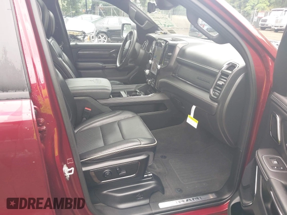 2023 Ram 1500 Limited with VIN 1C6SRFHM2PN509939, listed as a IAAI auction lot 42514018 with 31,669 mi miles and . Bid and sale history available at DreamBid. Image 5.