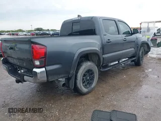 2022 Toyota Tacoma SR5 with VIN 3TMAZ5CN9NM195132, listed as a IAAI auction lot 42383482 with 51,011 mi miles and . Bid and sale history available at DreamBid. Image 4.