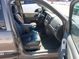 2003 Mazda Tribute ES with VIN 4F2CZ96113KM52877, listed as a IAAI auction lot 42217251 with 218,475 mi miles and . Bid and sale history available at DreamBid. Image 5.