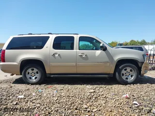 2012 Chevrolet Suburban LT with VIN 1GNSCJE03CR128206, listed as a IAAI auction lot 42002119 with 329,078 mi miles. Bid and sale history available at carsss.com. Image 13.