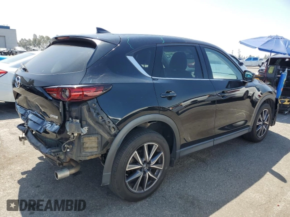 2018 Mazda CX-5 Grand Touring with VIN JM3KFBDM4J0348165, listed as a Copart auction lot 62733665 with 80,693 mi miles and Salvage title. Bid and sale history available at DreamBid. Image 3.