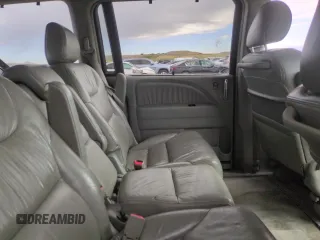 2005 Honda Odyssey Touring z VIN 5FNRL38855B051447, wystawiony jako Copart lot #57144925 z przebiegiem 186 476 mil mil oraz Szkoda całkowita • Salvage title. Historia ofert i sprzedaży dostępna na DreamBid. Obrazek 11.