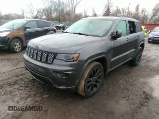 2020 Jeep Grand Cherokee Altitude with VIN 1C4RJFAGXLC211518, listed as a IAAI auction lot 41668994 with 130,371 mi miles. Bid and sale history available at carsss.com. Image 18.