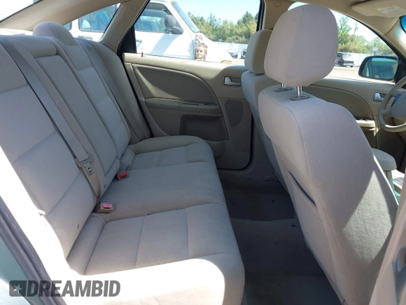 2005 Ford Five Hundred SE z VIN 1FAFP23185G168799, wystawiony jako IAAI lot #42202907 z przebiegiem Nie podano mil oraz . Historia ofert i sprzedaży dostępna na DreamBid. Obrazek 8.