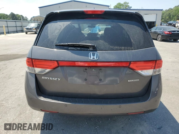 2014 Honda Odyssey Touring with VIN 5FNRL5H93EB061754, listed as a Copart auction lot 55182015 with 168,058 mi miles and Salvage title. Bid and sale history available at DreamBid. Image 6.