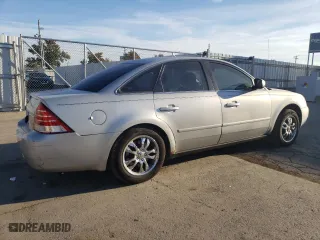 2005 Mercury Montego Premier with VIN 1MEFM43165G608323, listed as a Copart auction lot 77156404 with 138,150 mi miles and Salvage Title. Bid and sale history available at carsss.com. Image 3.