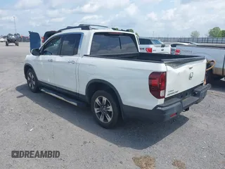 2019 Honda Ridgeline RTL-E with VIN 5FPYK3F77KB021667, listed as a IAAI auction lot 42115019 with 87,221 mi miles and . Bid and sale history available at DreamBid. Image 3.