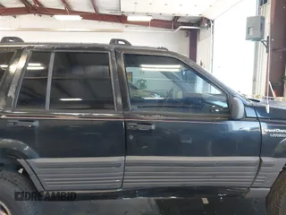 1995 Jeep Grand Cherokee Laredo z VIN 1J4GZ58Y3SC670696, wystawiony jako IAAI lot #42530934 z przebiegiem 165 658 mil mil oraz . Historia ofert i sprzedaży dostępna na DreamBid. Obrazek 13.