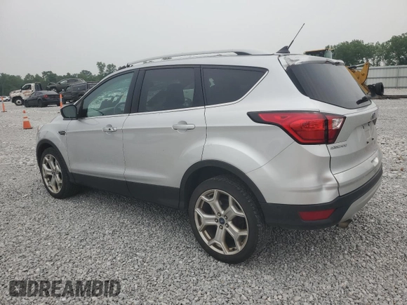 2019 Ford Escape Titanium with VIN 1FMCU9J90KUA07976, listed as a Copart auction lot 59565275 with 189,655 mi miles and Salvage title. Bid and sale history available at DreamBid. Image 2.