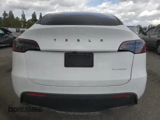 2023 Tesla Model Y Long Range z VIN 7SAYGDEE3PF916132, wystawiony jako Copart lot #51645625 z przebiegiem 28 238 mil mil oraz Szkoda całkowita • Salvage title. Historia ofert i sprzedaży dostępna na DreamBid. Obrazek 6.