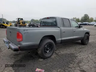 2003 Dodge Dakota Sport with VIN 1D7HL38N63S192308, listed as a Copart auction lot 77494684 with 128,512 mi miles and Salvage Title. Bid and sale history available at carsss.com. Image 3.