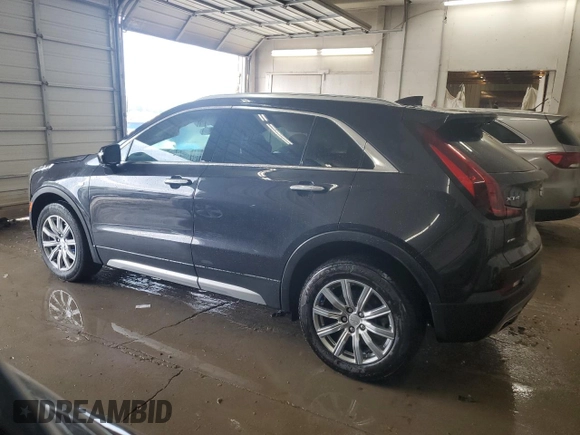 2023 Cadillac XT4 AWD Premium Luxury z VIN 1GYFZDR43PF174188, wystawiony jako Copart lot #59106355 z przebiegiem 27 530 mil mil oraz Szkoda całkowita • Salvage title. Historia ofert i sprzedaży dostępna na DreamBid. Obrazek 2.