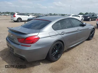 2014 BMW 6 Series 650i z VIN WBA6B2C55ED128934, wystawiony jako IAAI lot #42070641 z przebiegiem 102 597 mil mil oraz . Historia ofert i sprzedaży dostępna na DreamBid. Obrazek 4.