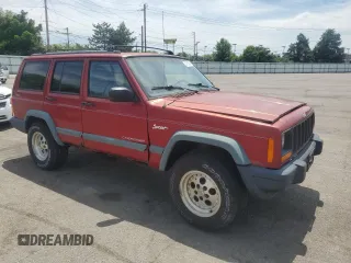 1998 Jeep Cherokee Sport with VIN 1J4FJ68S2WL285432, listed as a Copart auction lot 57183145 with 284,162 mi miles and Clean title. Bid and sale history available at DreamBid. Image 4.