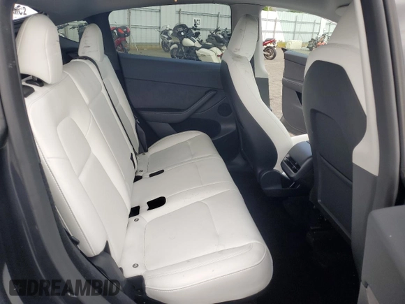2024 Tesla Model Y Performance with VIN 7SAYGDEF7RF093054, listed as a Copart auction lot 50747985 with 26,907 mi miles and Salvage Title. Bid and sale history available at DreamBid. Image 11.