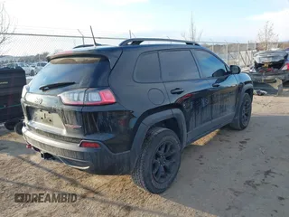 2022 Jeep Cherokee Trailhawk with VIN 1C4PJMBX7ND508267, listed as a IAAI auction lot 41356773 with 74,019 mi miles. Bid and sale history available at carsss.com. Image 4.