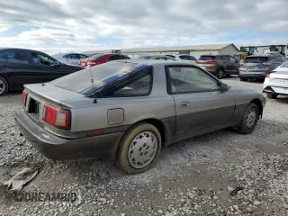 1986 Toyota Supra z VIN JT2MA70L3G0009411, wystawiony jako Copart lot #87545755 z przebiegiem 151 108 mil mil oraz Czysty tytuł • Clean title. Historia ofert i sprzedaży dostępna na DreamBid. Obrazek 3.