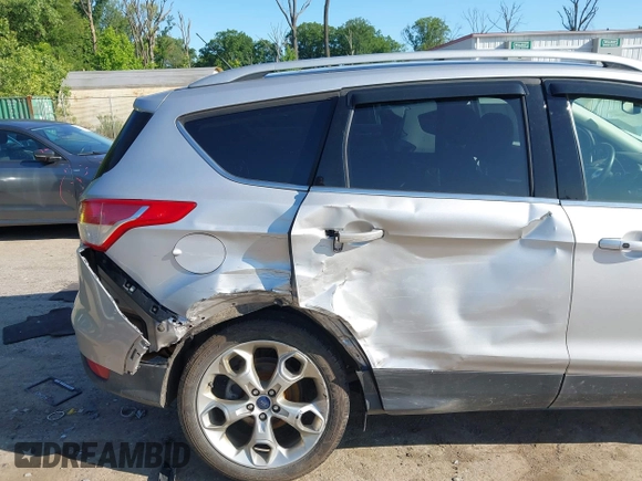 2016 Ford Escape Titanium with VIN 1FMCU9J97GUB91966, listed as a IAAI auction lot 42378829 with 121,218 mi miles and . Bid and sale history available at DreamBid. Image 6.