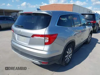 2020 Honda Pilot EX-L with VIN 5FNYF5H46LB004744, listed as a IAAI auction lot 42095298 with 76,159 mi miles and . Bid and sale history available at DreamBid. Image 4.