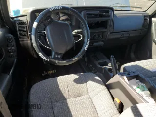 2000 Jeep Cherokee z VIN 1J4FF48S0YL142309, wystawiony jako Copart lot #46277785 z przebiegiem 148 966 mil mil oraz Nie do naprawy • Non repairable. Historia ofert i sprzedaży dostępna na DreamBid. Obrazek 8.