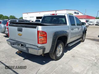 2013 Chevrolet Silverado 1500 LT with VIN 3GCPKSE71DG203443, listed as a IAAI auction lot 42033447 with 128,904 mi miles. Bid and sale history available at carsss.com. Image 4.