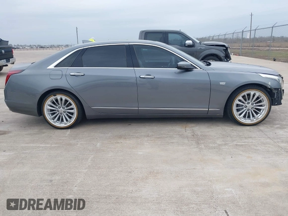 2018 Cadillac CT6 Luxury RWD z VIN 1G6KC5RX4JU159789, wystawiony jako IAAI lot #41145010 z przebiegiem 73 811 mil mil oraz . Historia ofert i sprzedaży dostępna na DreamBid. Obrazek 13.