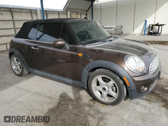 2010 MINI Convertible with VIN WMWMR3C50ATU97547, listed as a Copart auction lot 44780185 with 91,194 mi miles and Salvage Title. Bid and sale history available at DreamBid. Image 4.