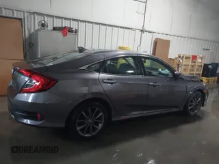2020 Honda Civic EX-L with VIN 19XFC1F70LE010163, listed as a IAAI auction lot 41306532 with 88,767 mi miles and . Bid and sale history available at DreamBid. Image 13.