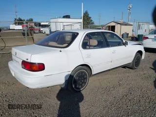 1995 Toyota Camry LE z VIN JT2SK12E5S0332027, wystawiony jako IAAI lot #42078977 z przebiegiem 128 929 mil mil oraz . Historia ofert i sprzedaży dostępna na DreamBid. Obrazek 4.
