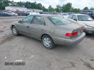 2001 Toyota Camry CE with VIN 4T1BG28K11U040227, listed as a IAAI auction lot 42220307 with 212,125 mi miles and . Bid and sale history available at DreamBid. Image 3.