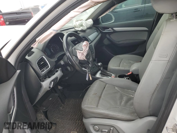 2017 Audi Q3 Premium z VIN WA1BCCFS0HR016968, wystawiony jako Copart lot #79358604 z przebiegiem Nie podano mil oraz Szkody całkowita. Historia ofert i sprzedaży dostępna na DreamBid. Obrazek 7.