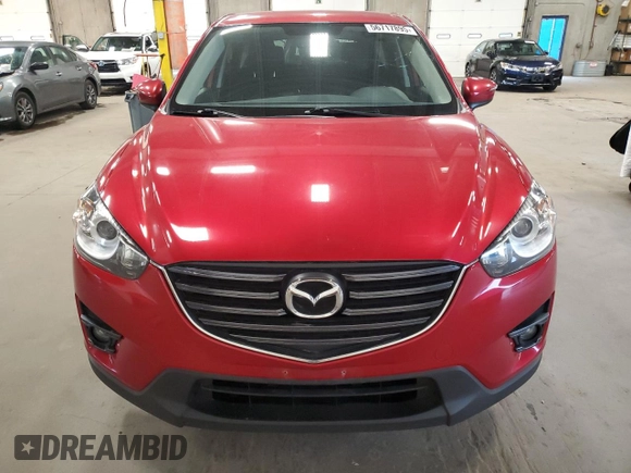 2016 Mazda CX-5 Touring z VIN JM3KE4CY7G0898598, wystawiony jako Copart lot #56717895 z przebiegiem 103 548 mil mil oraz Szkoda całkowita • Salvage title. Historia ofert i sprzedaży dostępna na DreamBid. Obrazek 5.