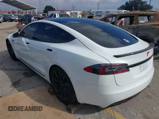 2016 Tesla Model S 90D with VIN 5YJSA1E27GF153525, listed as a IAAI auction lot 41539221 with 145,771 mi miles and . Bid and sale history available at DreamBid. Image 3.