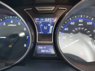 2013 Hyundai Veloster Turbo z VIN KMHTC6AE7DU124293, wystawiony jako IAAI lot #41924836 z przebiegiem 141 685 mil mil oraz . Historia ofert i sprzedaży dostępna na DreamBid. Obrazek 7.