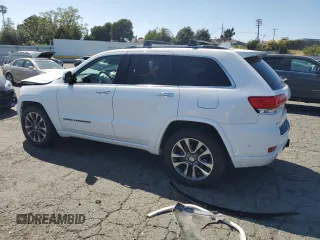 2017 Jeep Grand Cherokee Overland with VIN 1C4RJFCT5HC777748, listed as a Copart auction lot 63121635 with 106,991 mi miles and Salvage title. Bid and sale history available at DreamBid. Image 2.