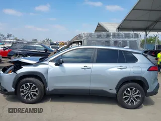 2023 Toyota Corolla Cross Hybrid S with VIN 7MUFBABG1PV014992, listed as a IAAI auction lot 42202656 with 18,913 mi miles and . Bid and sale history available at DreamBid. Image 14.