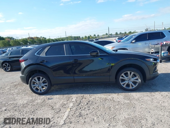 2023 Mazda CX-30 S Select with VIN 3MVDMBBM9PM508958, listed as a IAAI auction lot 42009029 with 21,219 mi miles and . Bid and sale history available at DreamBid. Image 14.