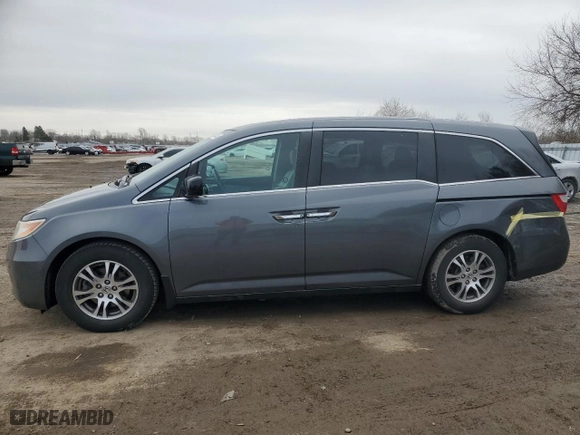 2012 Honda Odyssey EX-L with VIN 5FNRL5H61CB508181, listed as a Copart auction lot 52174205 with 203,763 mi miles and Salvage Title. Bid and sale history available at carsss.com. Image 1.
