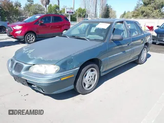1998 Pontiac Grand Am SE with VIN 1G2NE52M2WC712123, listed as a IAAI auction lot 41939392 with 307,145 mi miles. Bid and sale history available at carsss.com. Image 2.