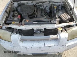 2001 Nissan Frontier XE z VIN 1N6DD21S41C395492, wystawiony jako Copart lot #59430105 z przebiegiem 108 576 mil mil oraz Tytuł czysty. Historia ofert i sprzedaży dostępna na DreamBid. Obrazek 11.