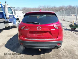 2014 Mazda CX-5 Touring with VIN JM3KE2CY2E0374440, listed as a IAAI auction lot 41634144 with 106,145 mi miles and . Bid and sale history available at DreamBid. Image 17.