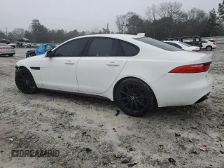 2016 Jaguar XF S with VIN SAJBG4BV6GCY17651, listed as a Copart auction lot 82511083 with 117,677 mi miles. Bid and sale history available at carsss.com. Image 2.