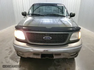 2001 Ford F-150 SuperCrew XLT with VIN 1FTRW08L41KB56181, listed as a Copart auction lot 70874634 with 209,227 mi miles and Clean Title. Bid and sale history available at carsss.com. Image 5.